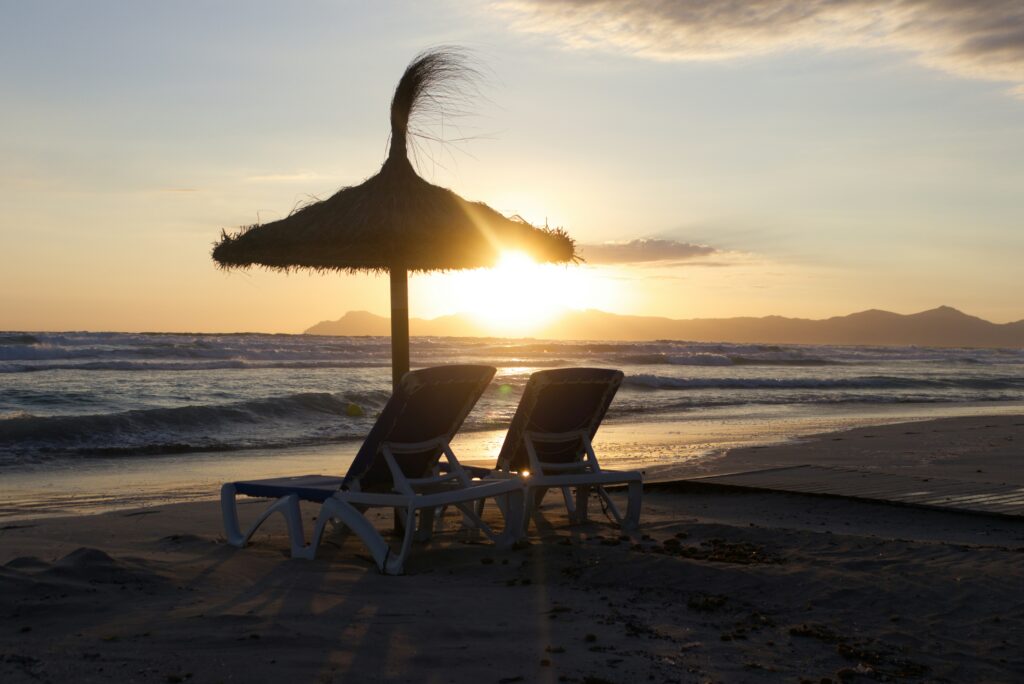 seats and sunshade on the beach of chilches